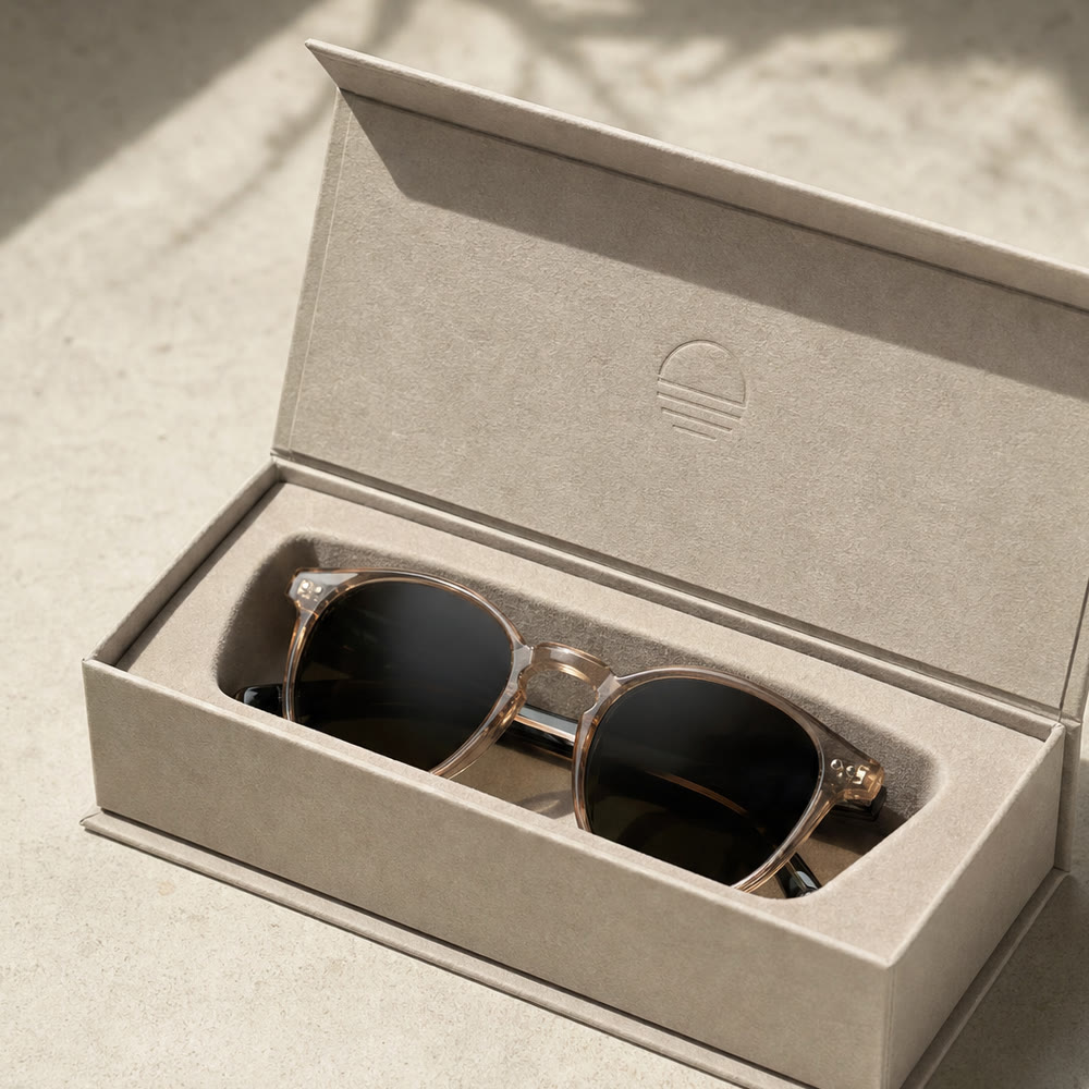 Rigid hinged case for sunglasses, open with glasses inside